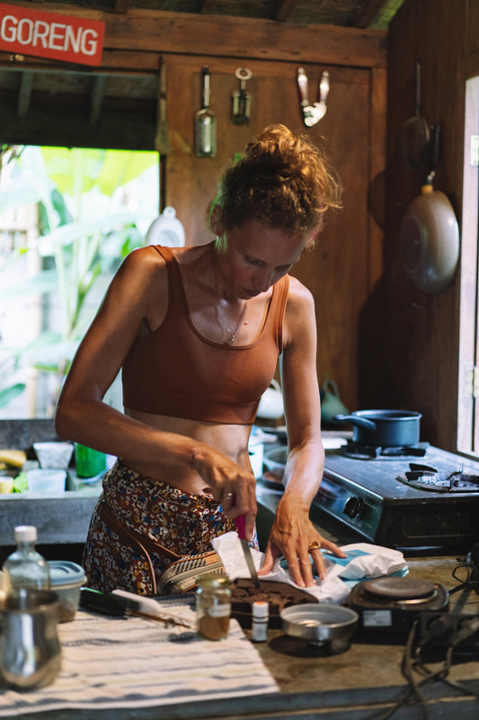 Gabrielle preparing ceremonial cacao in a Bali kitchen